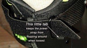 A simple tab of material makes the power strap release faster without causing trouble.