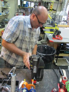 Jim Schaffner makes adjustments to the boots of a local US Ski Team member.