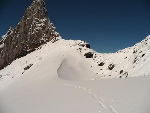 Booting up to the top of the saddle beneath Illumination Rock.