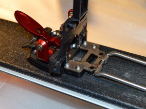 To access the rear mounting holes the baseplate must be partially disassembled.  Hint: When reassembling, it is easier to thread the spring knobs on when the baseplate is flat. 