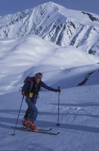 Smiling while earning in the Selkirk Mountains. 