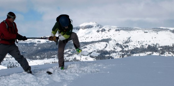 Logan Talbot, ASI Guide, tries to trigger a cornice break. He was successful. We were glad he was "on belay."