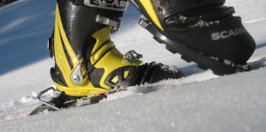 Dynafit caliber touring efficiency. The only thing you lift is your heel, not a binding.